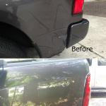 Gray truck back siding was fixed with paintless dent repair. 