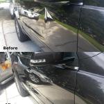 Side of a black truck repaired with paintless dent repair